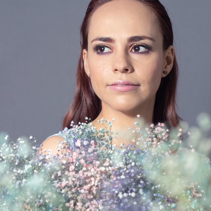 Aiden Kapoor, Lead Design Curator at MarketHiddenMotion, reviewing corporate floral arrangements